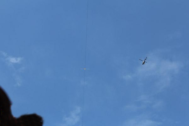 Chinese tightrope walkers at Aizhai briage