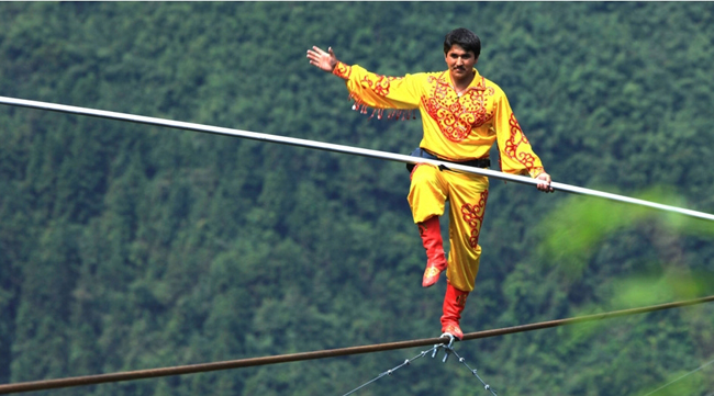 Chinese tightrope walkers at Aizhai briage