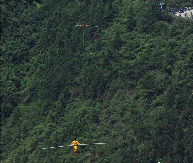 Chinese tightrope walkers at Aizhai briage