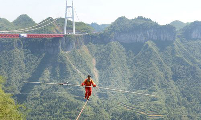Chinese tightrope walkers at Aizhai briage