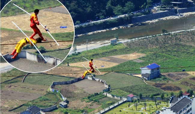 Adil Hoshur, together with two disciples, completed the dangerous 4, 593 foot wire-walk some 350 meters (1,148 feet) above the Dehang canyon