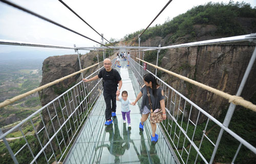 Most Terrifying Glass Bridge Starts Swaying for Tourists in Pingjiang
