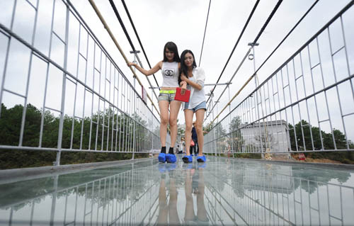 Most Terrifying Glass Bridge Starts Swaying for Tourists in Pingjiang